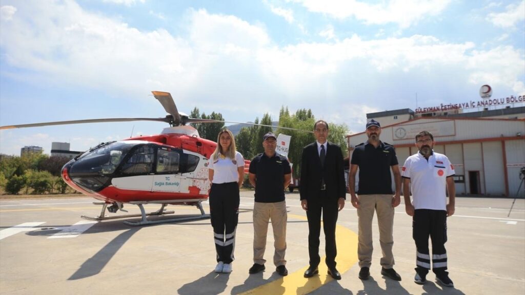 Air Ambulance Helicopter Team – Experienced flight physician, critical care nurse, paramedic, and helicopter pilot preparing for an emergency medical air ambulance mission with advanced life-support equipment.